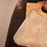 Clutch bag with embroidered flowers