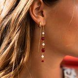 Long earrings with red stones