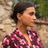 Gold flower chain and stone earrings | Tile